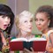 Women laughing at a romance novel